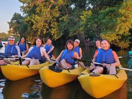 a group of people on a boat in the water