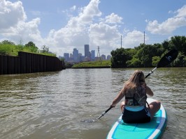 a person standing next to a body of water