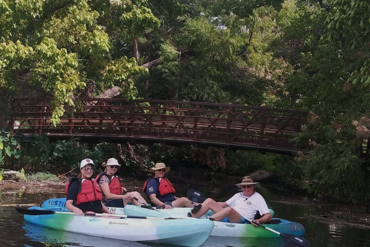a group of people riding on the back of a boat