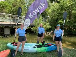 a group of people that are standing in the grass