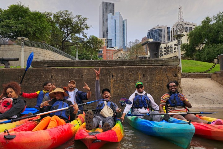 a group of people riding on the back of a boat